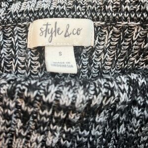 Asymmetrical black and white sweater
